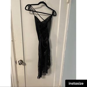 Silky black dress with lace on the bottom. Strappy back.